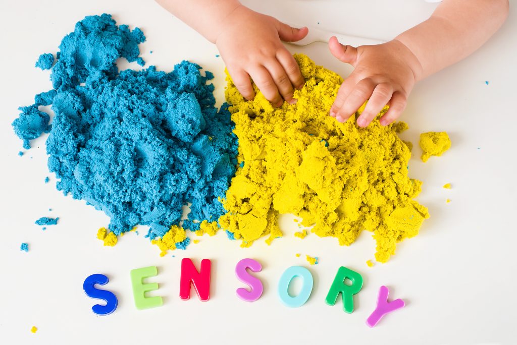 Sensory word and magic kinetic sand. Early sensory integration.